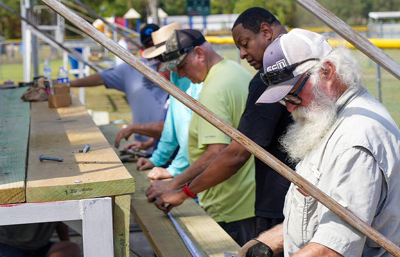 Community Volunteers Pitch in for Tomball Little League Field Work Day